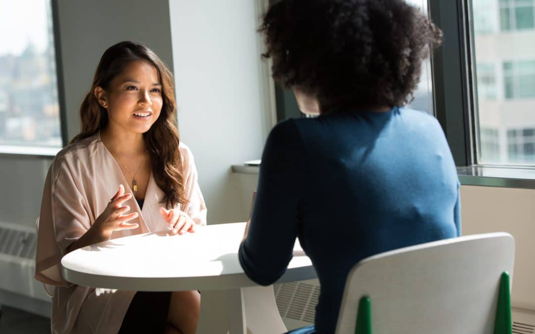 Two Women at Table - Financial Law